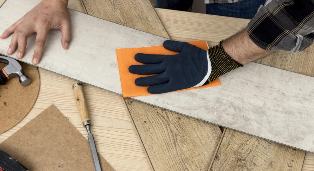 top-view-man-using-sand-paper-carpentry-workshop-concept